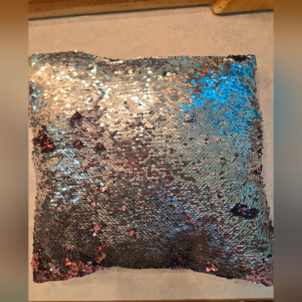Small sequined 2 toned throw pillow (silver and pink). Back is soft black suede.